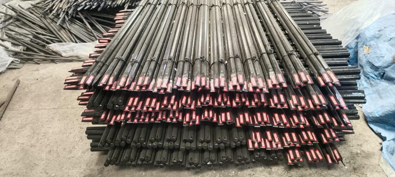 Metal rods stacked in stock